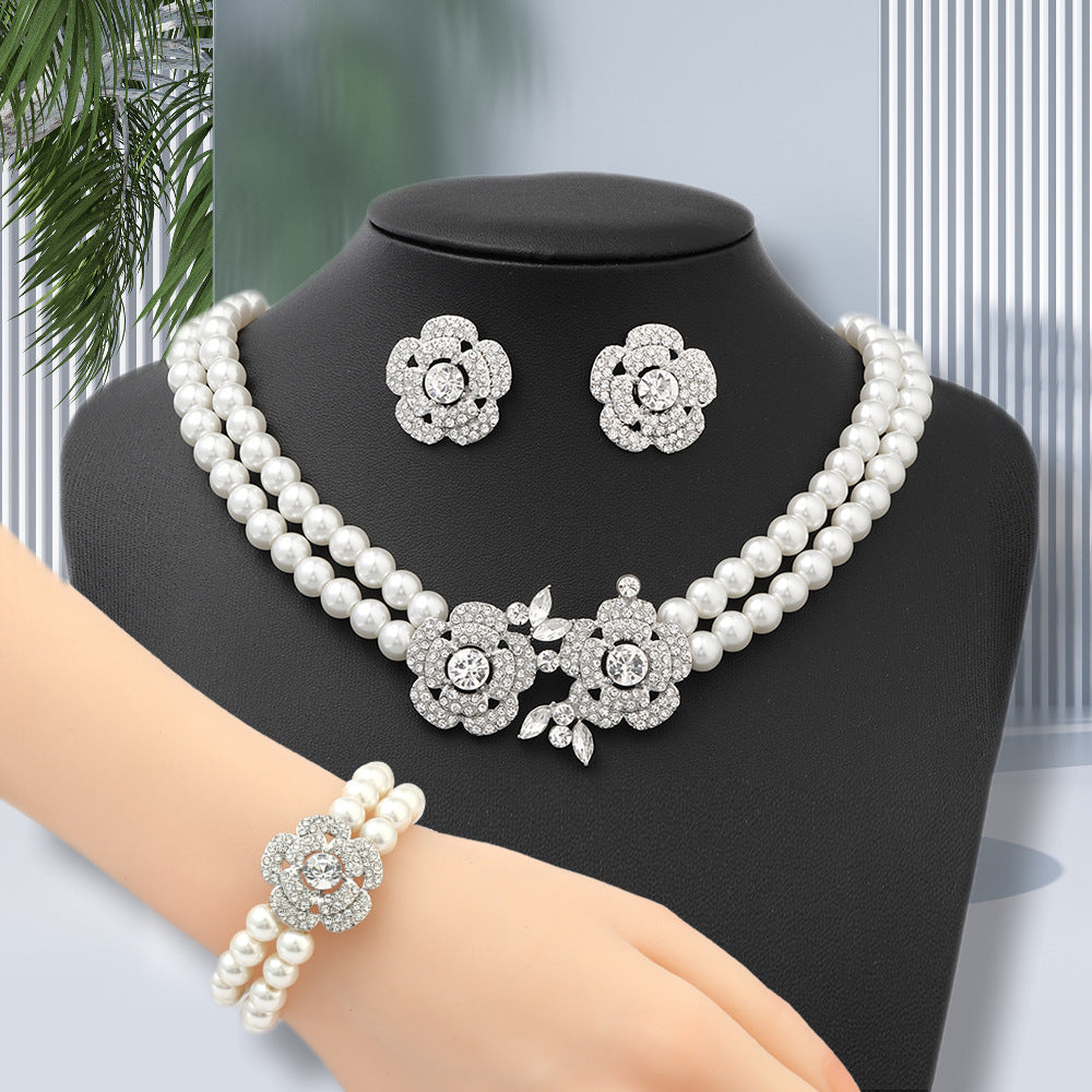 Diamond-studded floral faux pearl bracelet, earrings, and necklace set - fashionable, affordable luxury jewelry