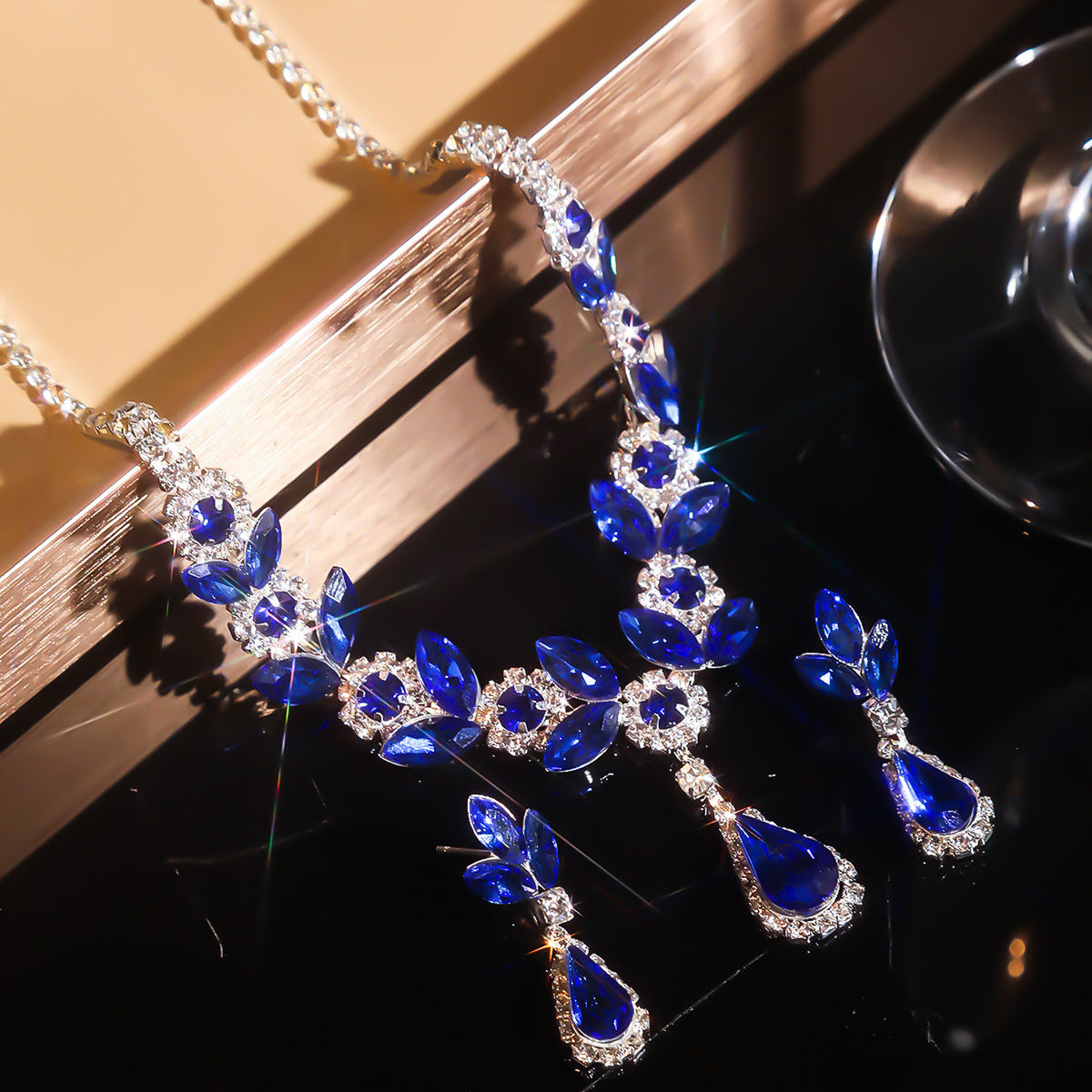 A fashionable set of purple flower necklaces, earrings and bracelets - perfect accessories for a bride's wedding party