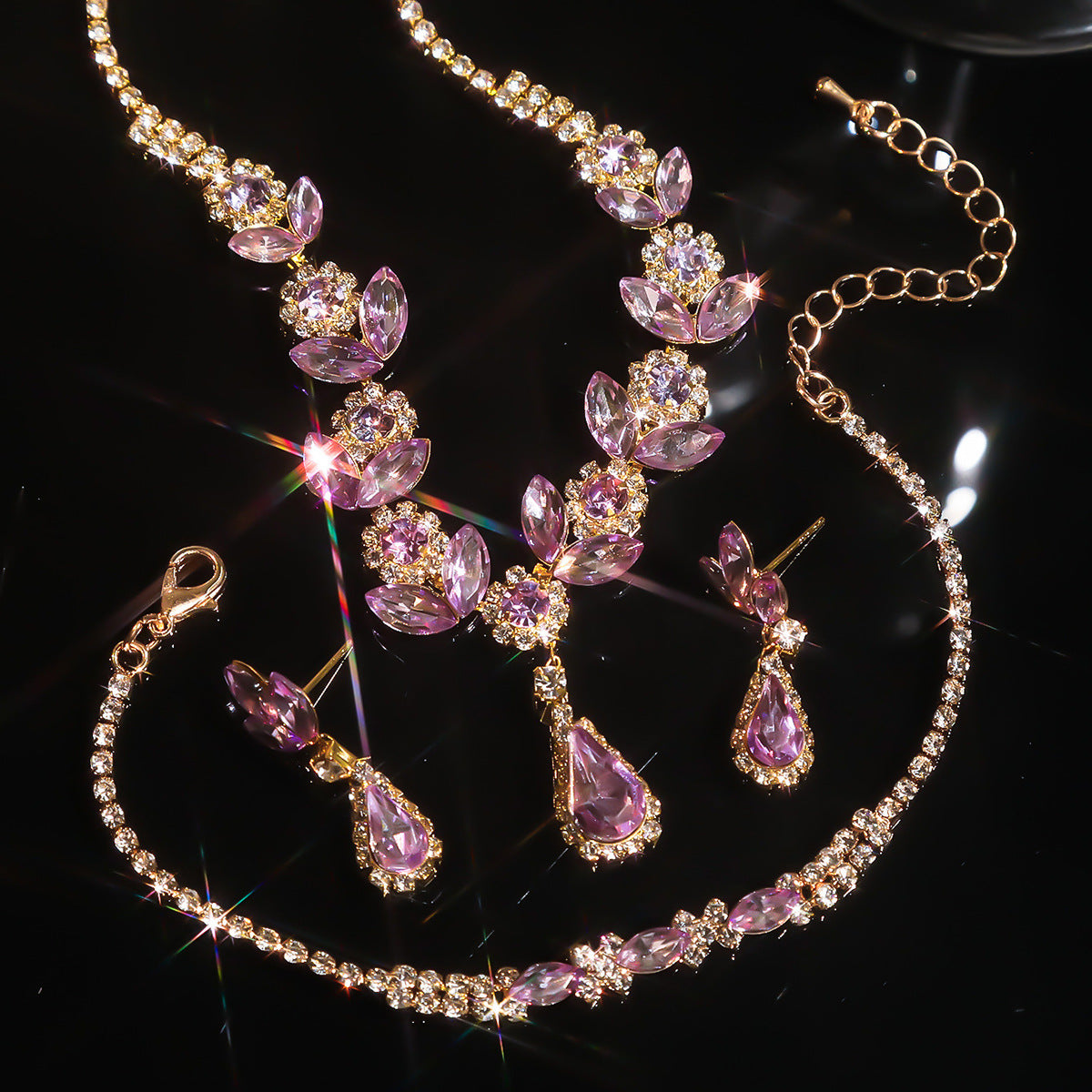 A fashionable set of purple flower necklaces, earrings and bracelets - perfect accessories for a bride's wedding party