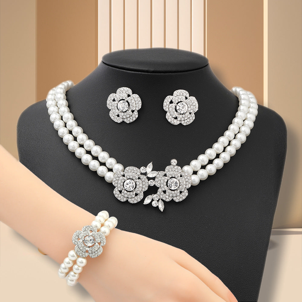 Diamond-studded floral faux pearl bracelet, earrings, and necklace set - fashionable, affordable luxury jewelry