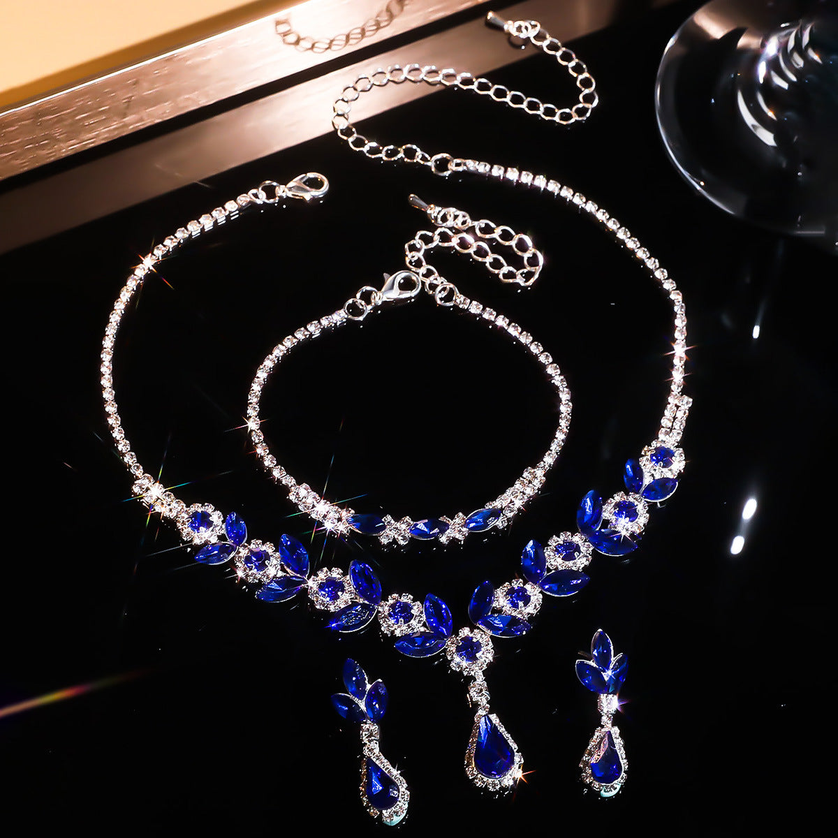 A fashionable set of purple flower necklaces, earrings and bracelets - perfect accessories for a bride's wedding party