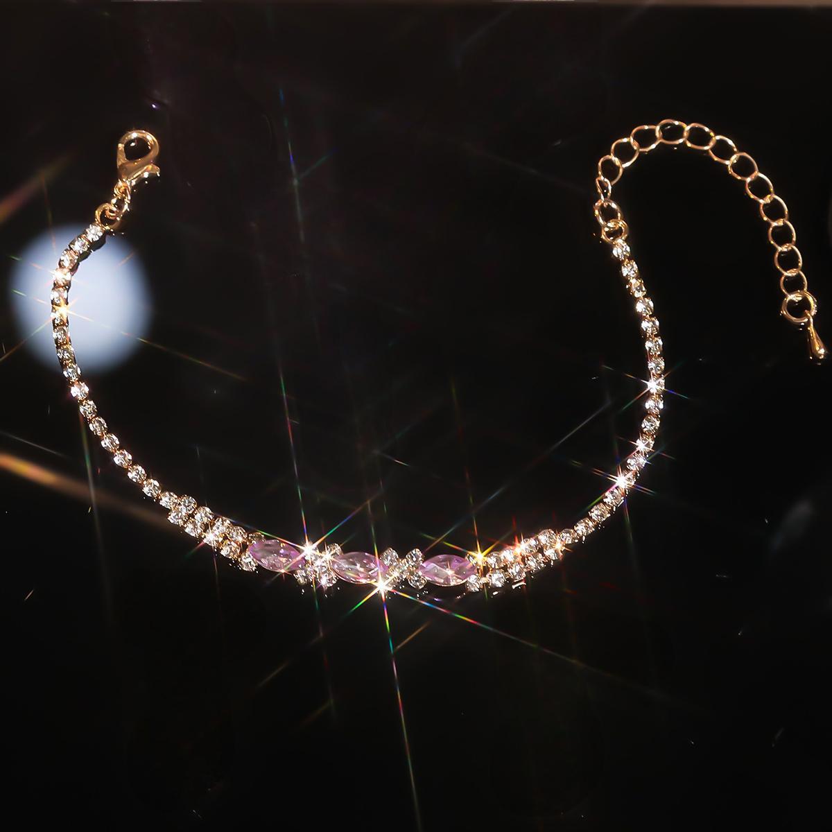 A fashionable set of purple flower necklaces, earrings and bracelets - perfect accessories for a bride's wedding party